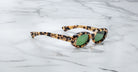 Jacques Marie Mage Besset cat-eye sunglasses in tortoiseshell with green lenses, top view.