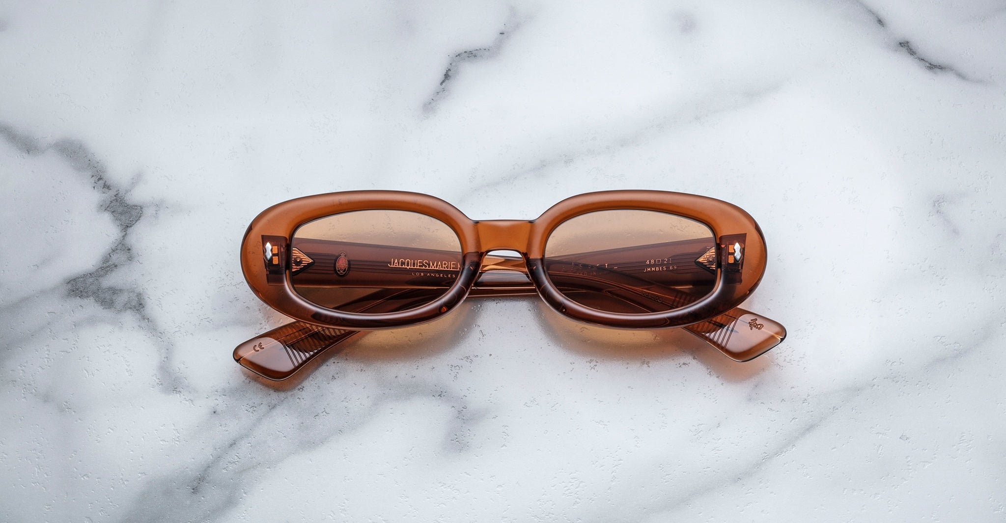 Jacques Marie Mage Besset sunglasses with thick brown rectangular frames, front view.