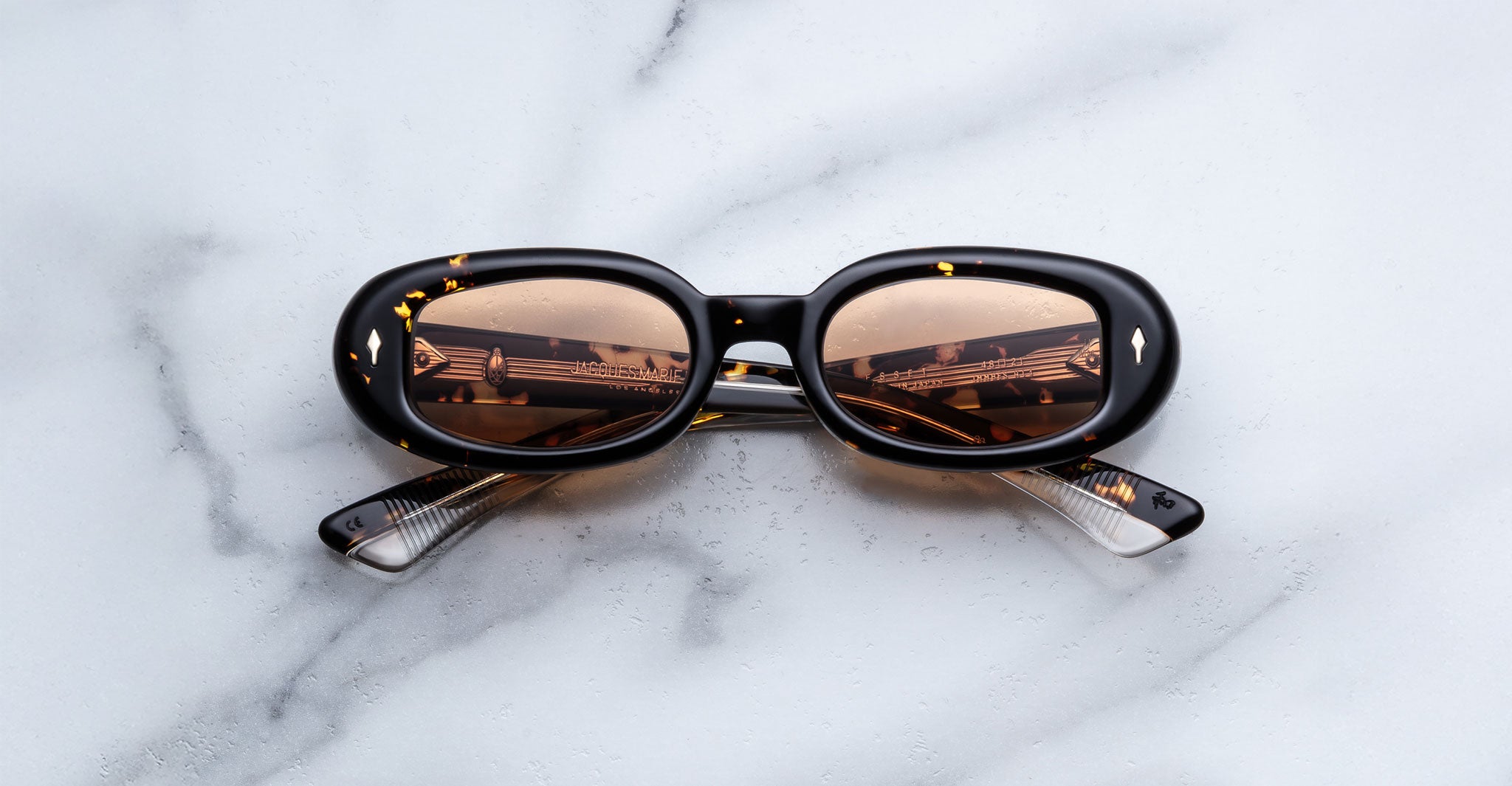 Jacques Marie Mage Besset sunglasses in brown and yellow tortoise shell pattern with orange lenses front view