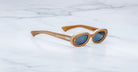 Jacques Marie Mage Besset sunglasses in tan with blue lenses shown at a front angle 