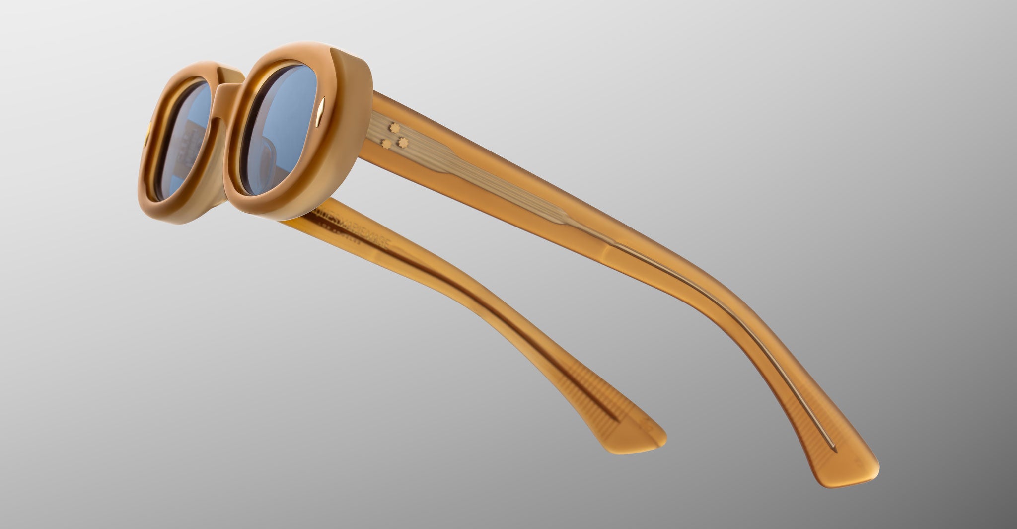 Jacques Marie Mage Besset sunglasses in tan with blue lenses close-up profile view