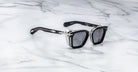 Jacques Marie Mage Borodino black square sunglasses with silver accents and UV protection, top view.