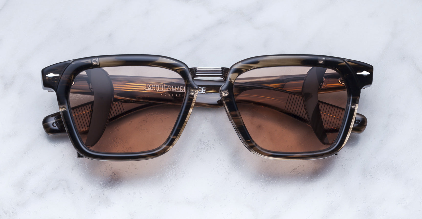 Jacques Marie Mage Borodino tortoiseshell sunglasses with brown lenses, shown from above.