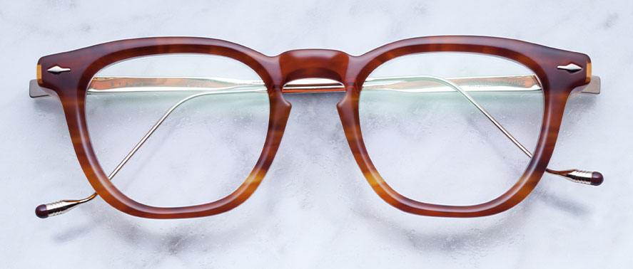 Front view of Jacques Marie Mage Byron style glasses in colorway tobacco