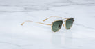 Jacques Marie Mage Cendrars aviator sunglasses with green lenses, top view.