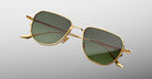 Jacques Marie Mage Cendrars gold aviator sunglasses with green lenses, front view.