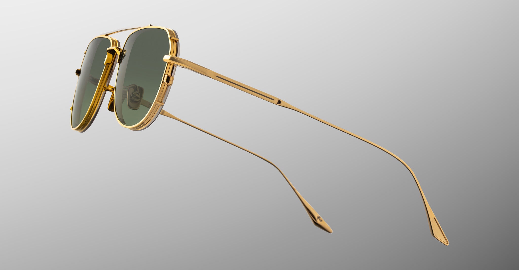 Jacques Marie Mage Cendrars gold aviator sunglasses with green lenses, front view.