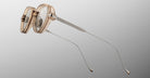 Jacques Marie Mage The Clark eyeglasses, transparent frame, thin metal arms, front view.