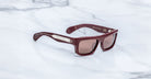 Jacques Marie Mage Cleavon 57 maroon rectangular sunglasses with thick frames and brown UV lenses, front view.