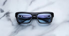 Jacques Marie Mage Cleavon 57 black rectangular sunglasses with blue polarized lenses, top view.