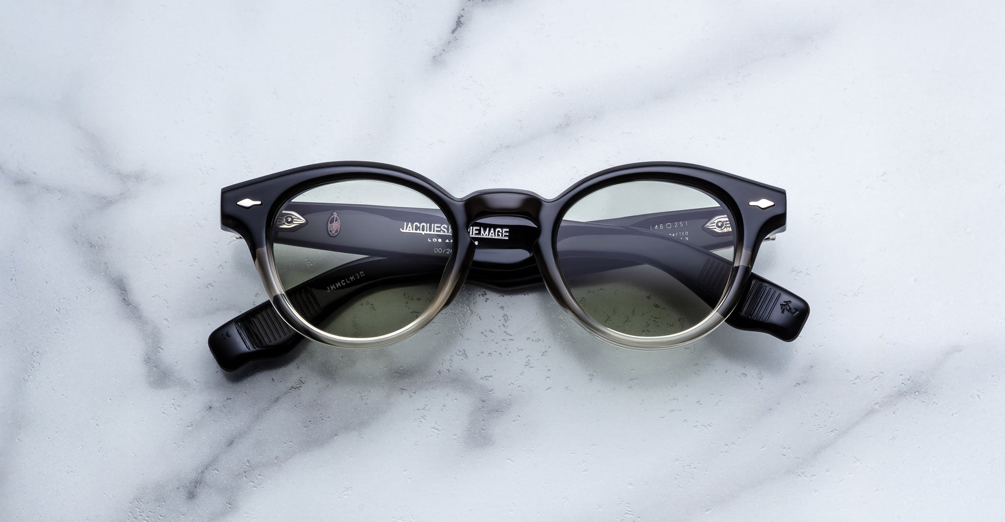 Jacques Marie Mage Clemens in Black Fade black lightweight eyeglasses with clear lenses, shown from above.