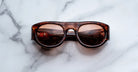 Jacques Marie Mage Clyde 2.0 in Bourbon brown acetate sunglasses with amber lenses viewed from the front