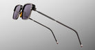 Jacques Marie Mage Comanche in Corbeau rectangular black sunglasses with UV-protection lenses and thin metal arms, side view.