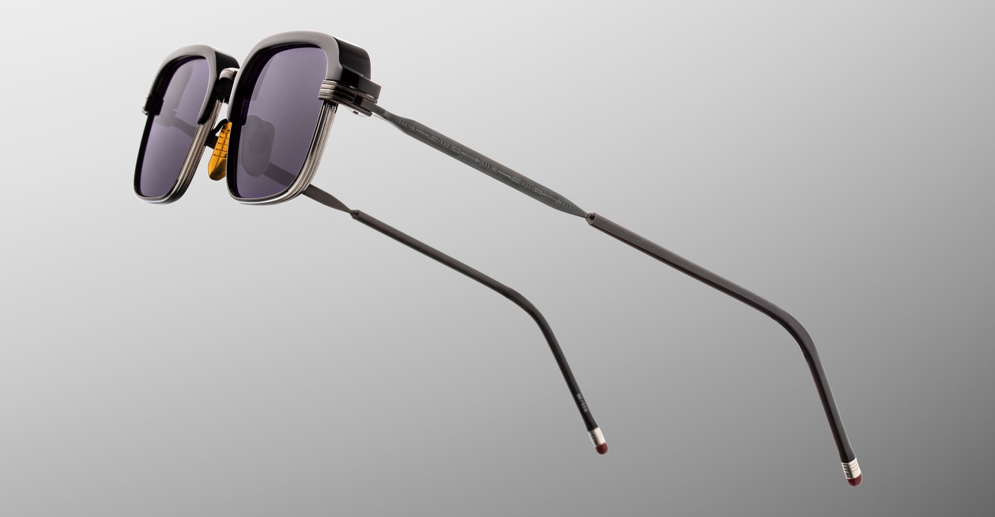 Jacques Marie Mage Comanche in Corbeau rectangular black sunglasses with UV-protection lenses and thin metal arms, side view.