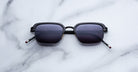 Jacques Marie Mage Comanche in Corbeau black rectangular sunglasses with dark lenses, front angle view, classic style eyewear.