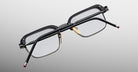 Jacques Marie Mage Comanche in Corbeau eyeglasses, black rectangular frame with clear lenses, sturdy temples, and nose pads; front view.