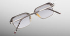 Jacques Marie Mage Comanche in Tempest rectangular eyeglasses with clear frames and silver arms, viewed from the back.