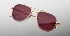 Three-quarter view of Jacques Marie Mage Commander in Champagne, showcasing the light gold-tone double-bridge frame, engraved aviator rims, and rose-champagne lenses with a warm, refined glow.