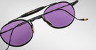 Detailed back view of the Jacques Marie Mage Dasan titanium sunglass in black color with purple lenses on a white background