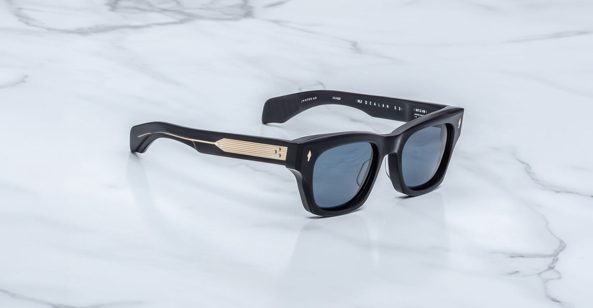 Jacques Marie Mage Dealan 53 black polarized sunglasses with gold temples, top view.