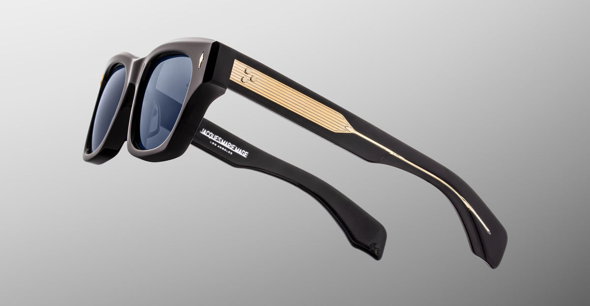 Jacques Marie Mage Dealan 53 black sunglasses with gold temple accents, front angle view.