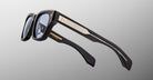Jacques Marie Mage Dealan 53 black smart eyeglasses with thick frames, metallic accents, and left-lens camera, front view.