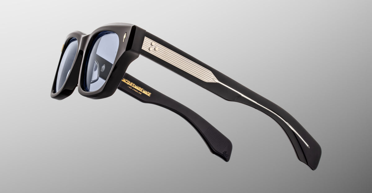 Jacques Marie Mage Dealan 53 black smart eyeglasses with thick frames, metallic accents, and left-lens camera, front view.