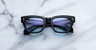 Jacques Marie Mage Dealan 53 black rectangular eyeglasses with clear lenses, top-down view.