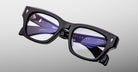 Jacques Marie Mage Dealan 53 black rectangular eyeglasses with thick frames, silver accents, and clear lenses, front view.