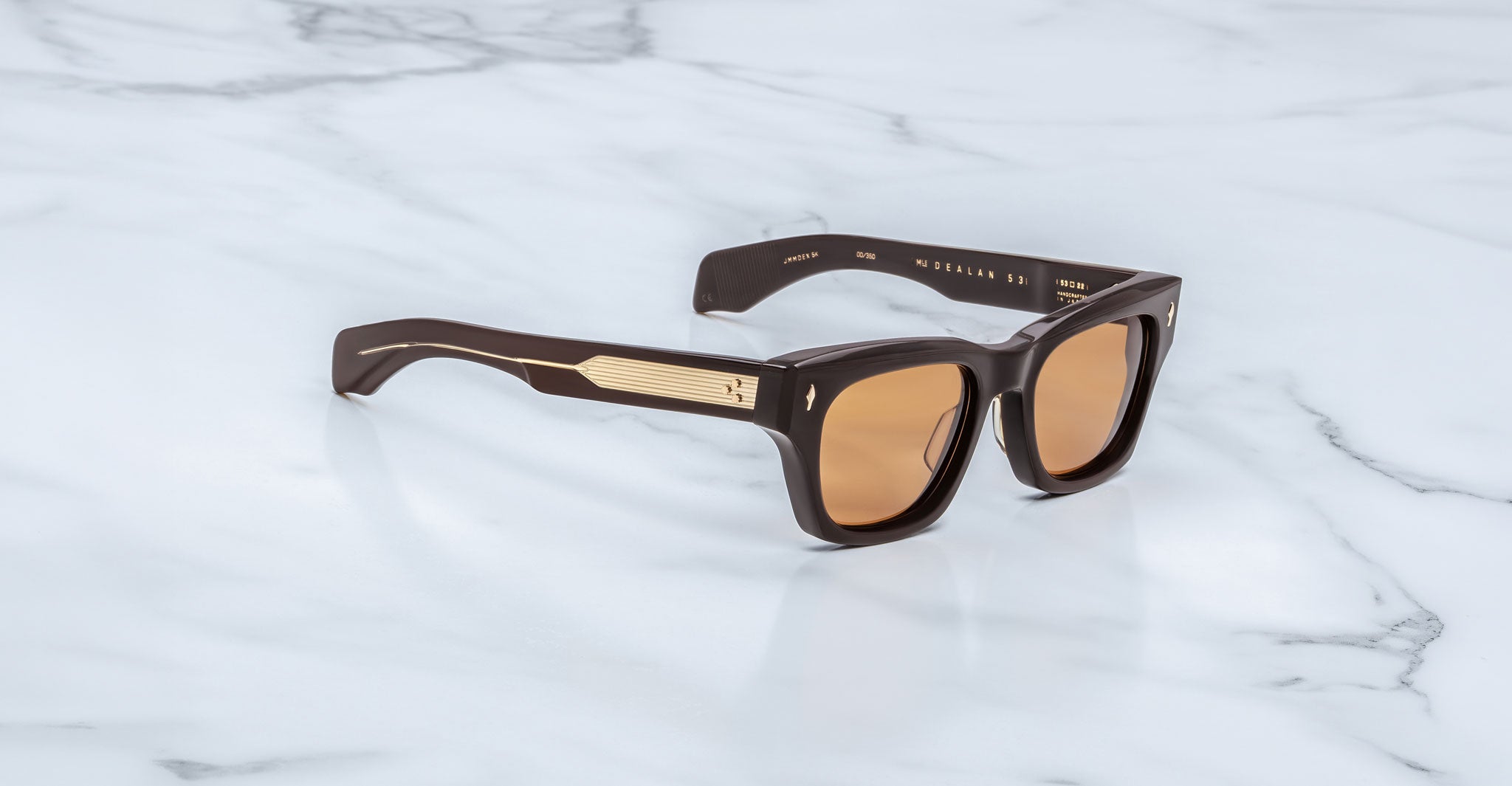 Jacques Marie Mage Dealan 53 sunglasses with gold temple accents, shown from above highlighting gold details.