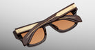 Jacques Marie Mage Dealan 53 brown sunglasses with gold-detailed arms, top view.