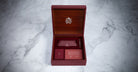 Jacques Marie Mage Enzo eyeglasses box with pen, envelope, and card, top view. No sunglasses or eyeglasses visible.