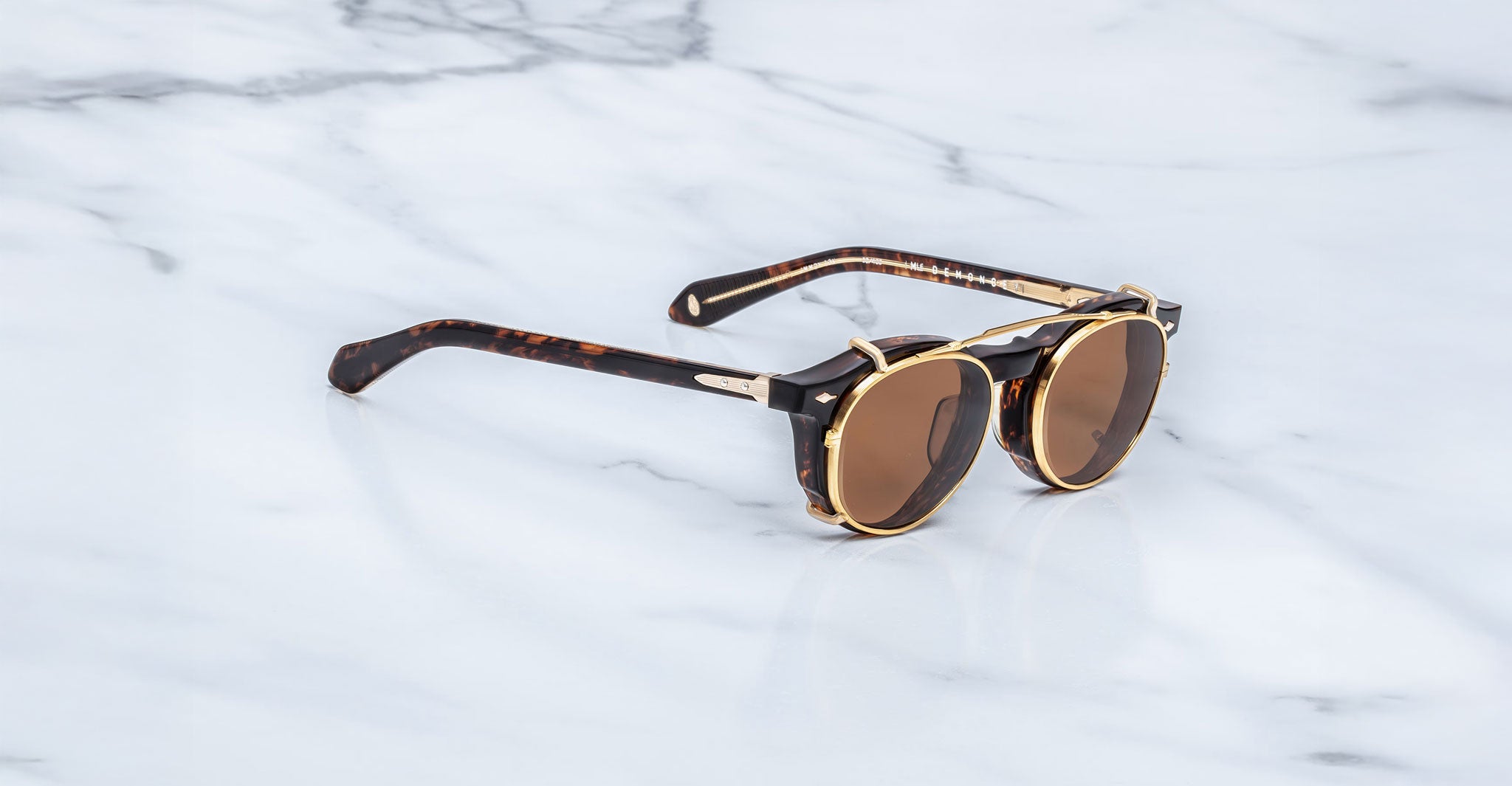Jacques Marie Mage Demoncey Clip-On sunglasses with tortoiseshell arms shown from above.