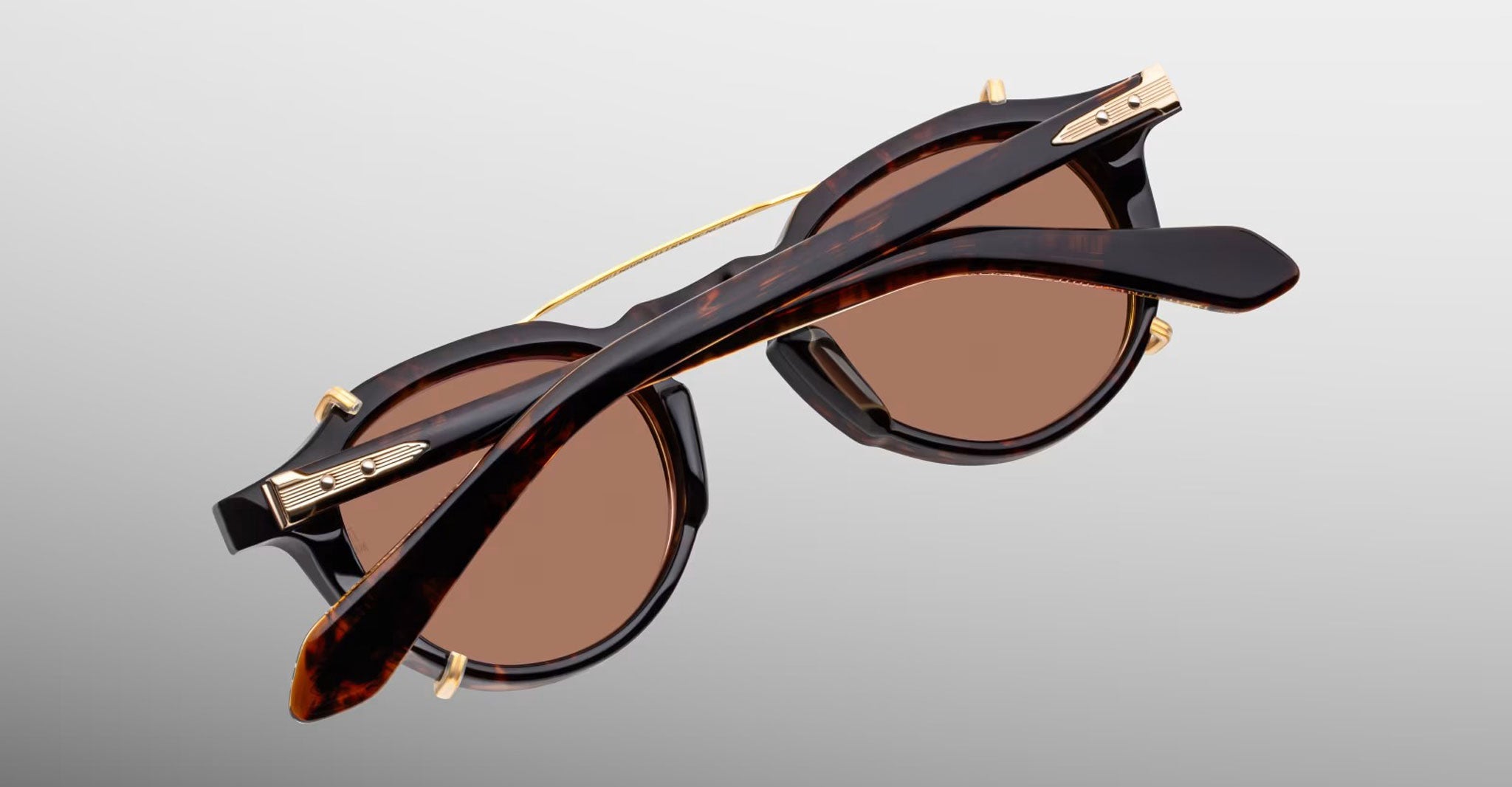 Jacques Marie Mage Demoncey Clip-On sunglasses, folded rear view, featuring gold accents on the frames.