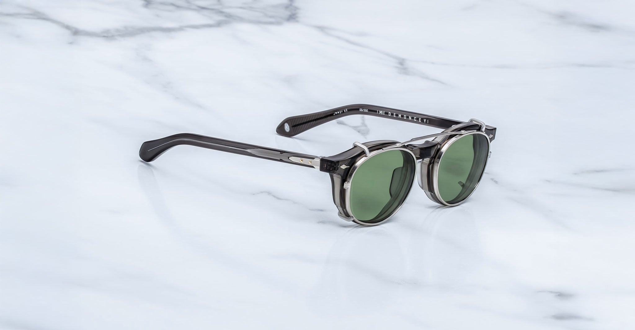 Jacques Marie Mage Demoncey Clip-On sunglasses, green lenses, black and silver frames, front view.