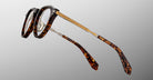 Jacques Marie Mage Desnos eyeglasses with gold temples, side view, designer eyewear by Jacques Marie Mage.