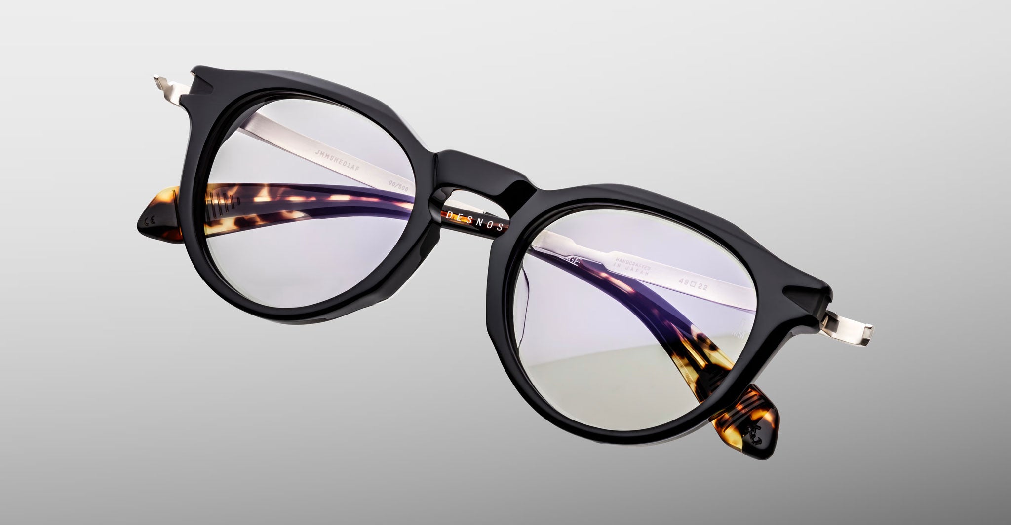 Jacques Marie Mage Desnos round black tortoiseshell eyeglasses with clear lenses, front view.