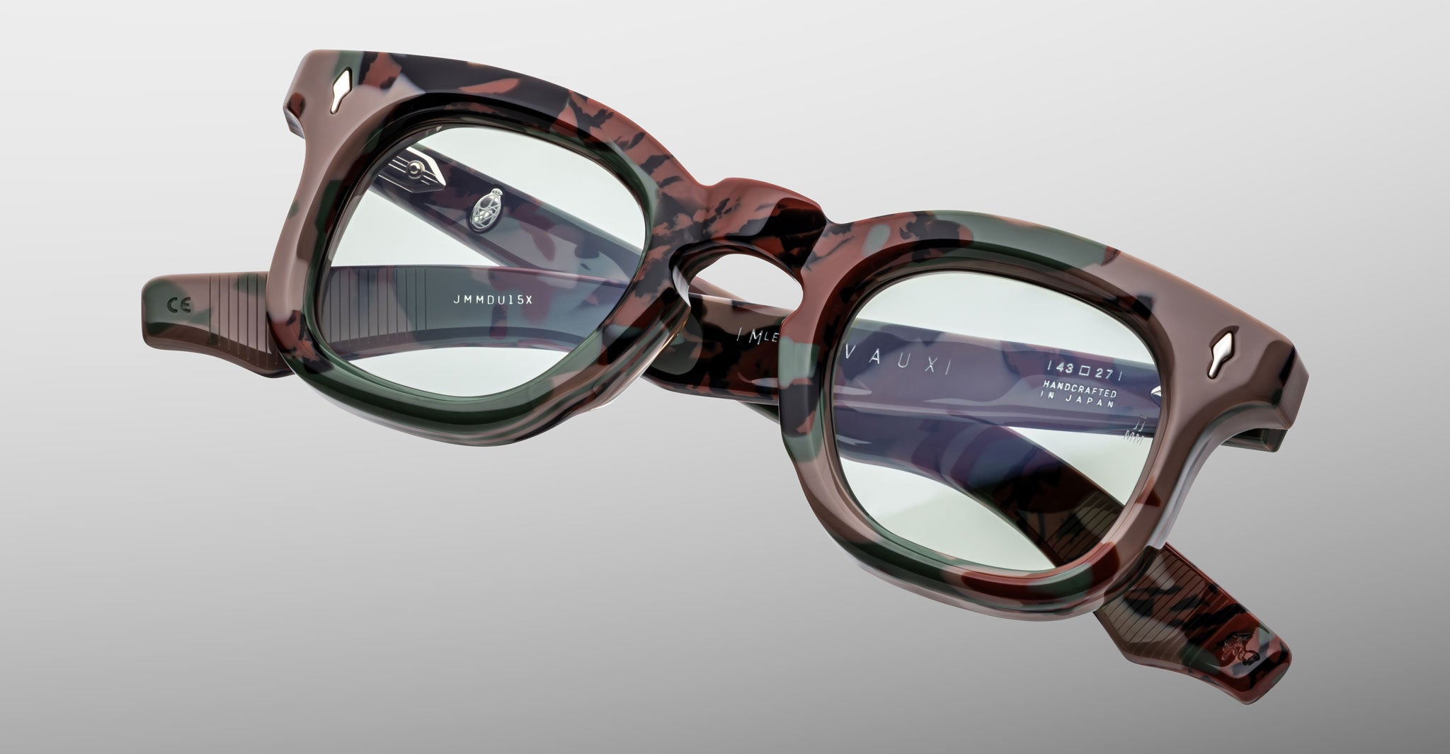 Jacques Marie Mage Devaux optical frame in Sergeant camoflauge pattern front view with folded temples on a light grey background