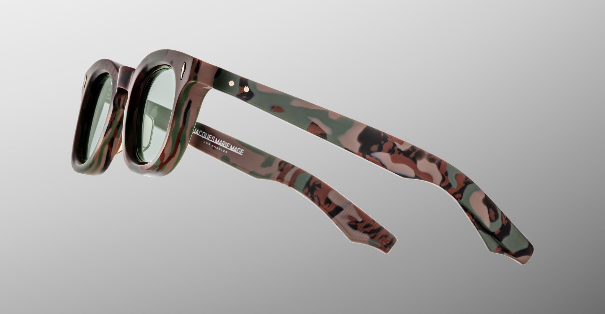 Jacques Marie Mage Devaux optical frame in Sergeant camoflauge pattern side view on a light grey background