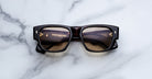 Jacques Marie Mage Dino in Agar tortoiseshell acetate sunglass frame with brown lenses, gold arrowhead pins, and sculptural wide temples, front view