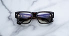 Jacques Marie Mage Dino in Agar tortoiseshell acetate sunglass frame with superlight bronze lenses, gold arrowhead pins, and sculptural wide temples