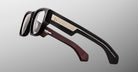 Jacques Marie Mage Dino in Bloodstone acetate optical frame with clear lenses, gold arrowhead pins, and sculptural wide temples, side view showing engraved wirecore and temple detail