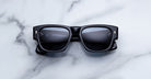 Jacques Marie Mage Dino in Lacquer dark blue acetate sunglass frame with lacquer dark blue lenses, gold arrowhead pins, and sculptural wide temples, front view