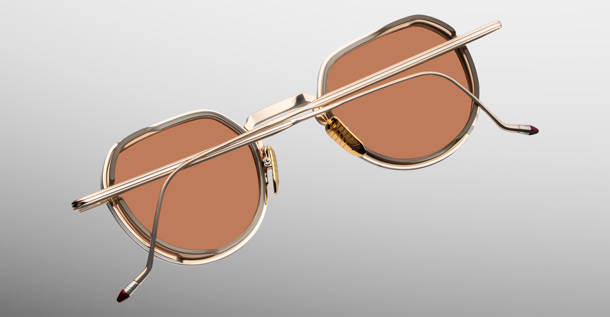Jacques Marie Mage Dixon gold aviator sunglasses with brown lenses, shown from the back.