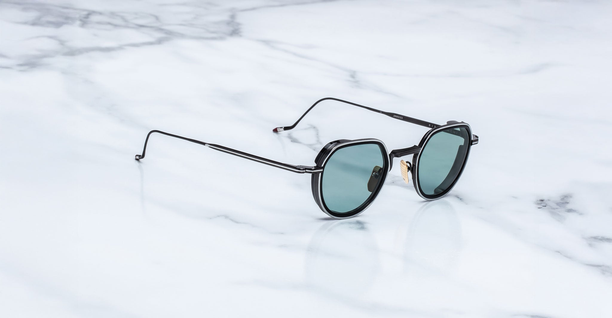 Jacques Marie Mage Dixon round black sunglasses with green lenses, front view.