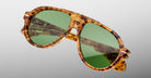 Jacques Marie Mage Donnybrooke in Vintage Tortoise aviator sunglasses in tortoiseshell with green tinted lenses, shown from a front-facing angle.