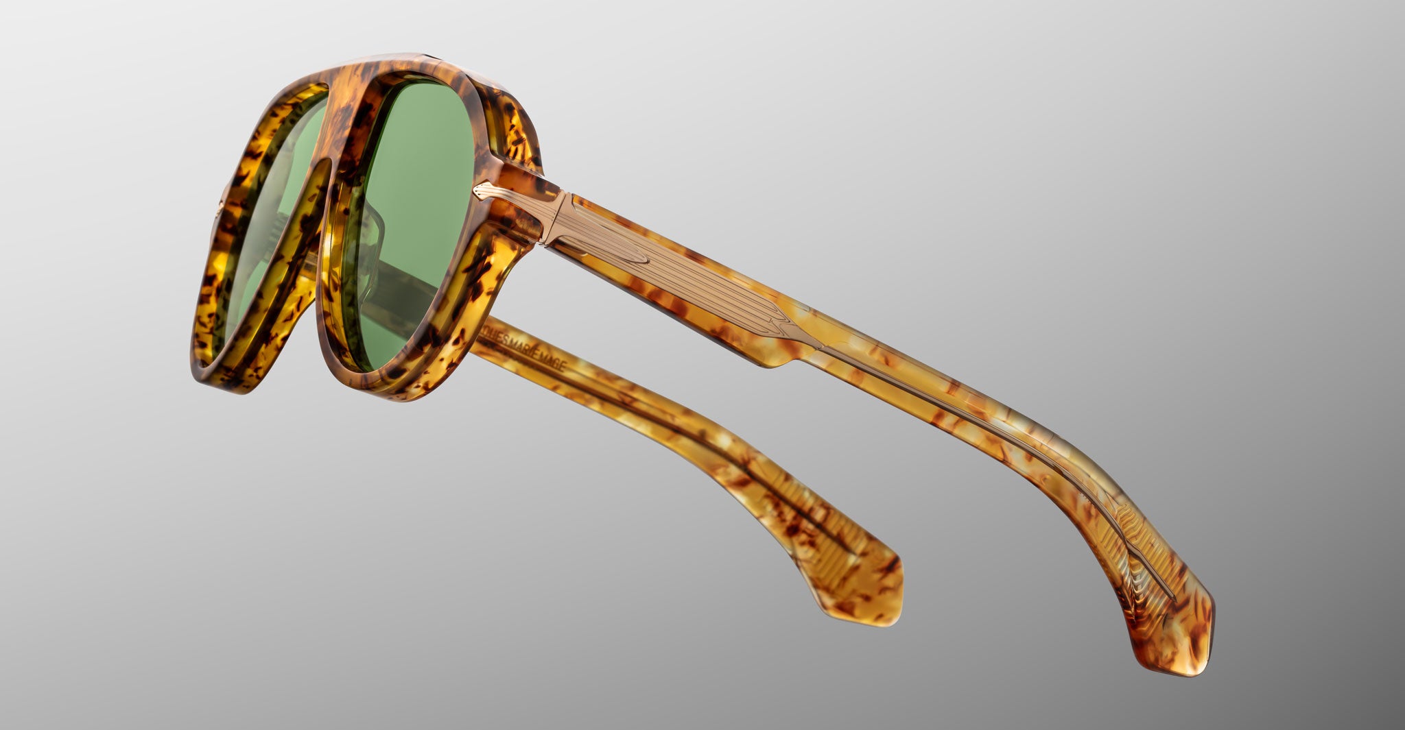 Jacques Marie Mage Donnybrooke in Vintage Tortoise brown tortoiseshell round sunglasses with green lenses, side view.