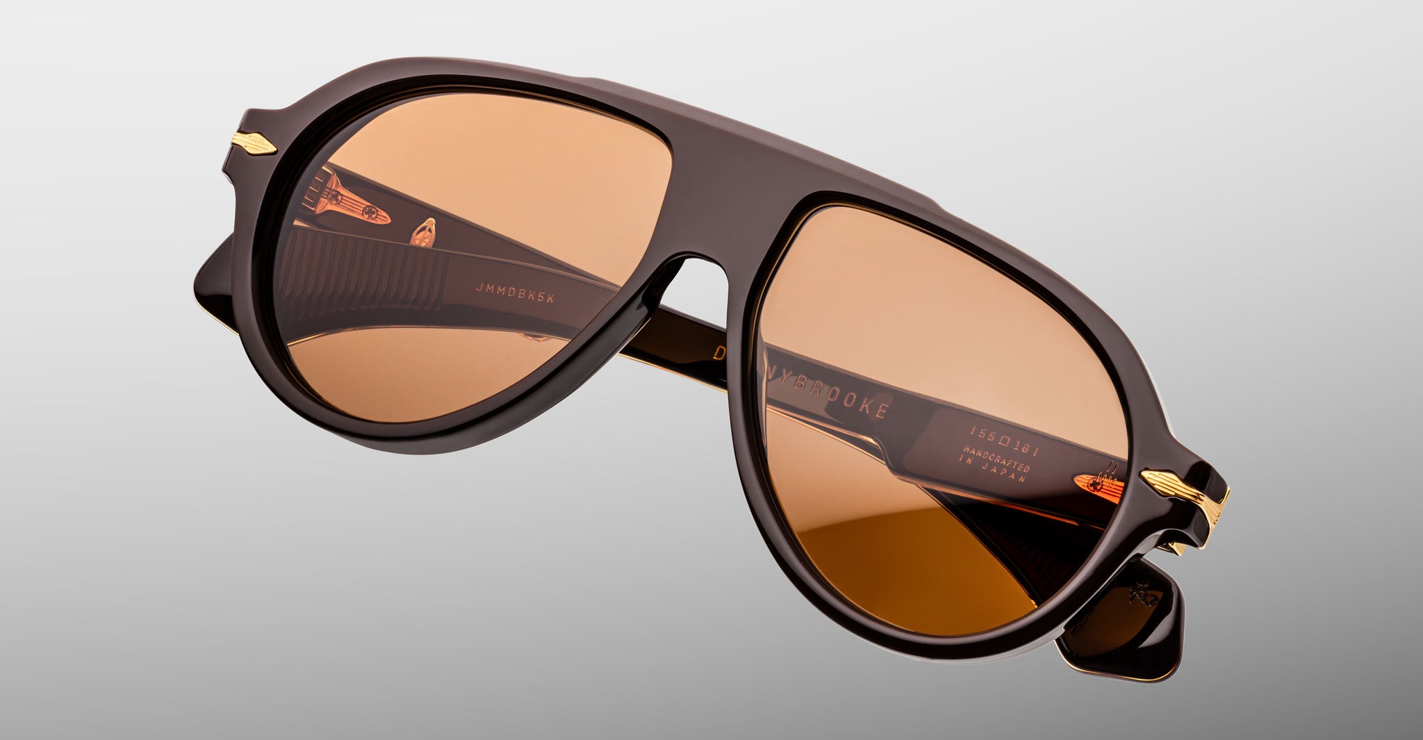 Jacques Marie Mage Donnybrooke in Walnut aviator sunglasses, brown lenses with gold accents, classic frame design shown from a front angle.