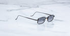 Jacques Marie Mage Dusk sunglasses, black metal square frames, top-front view.