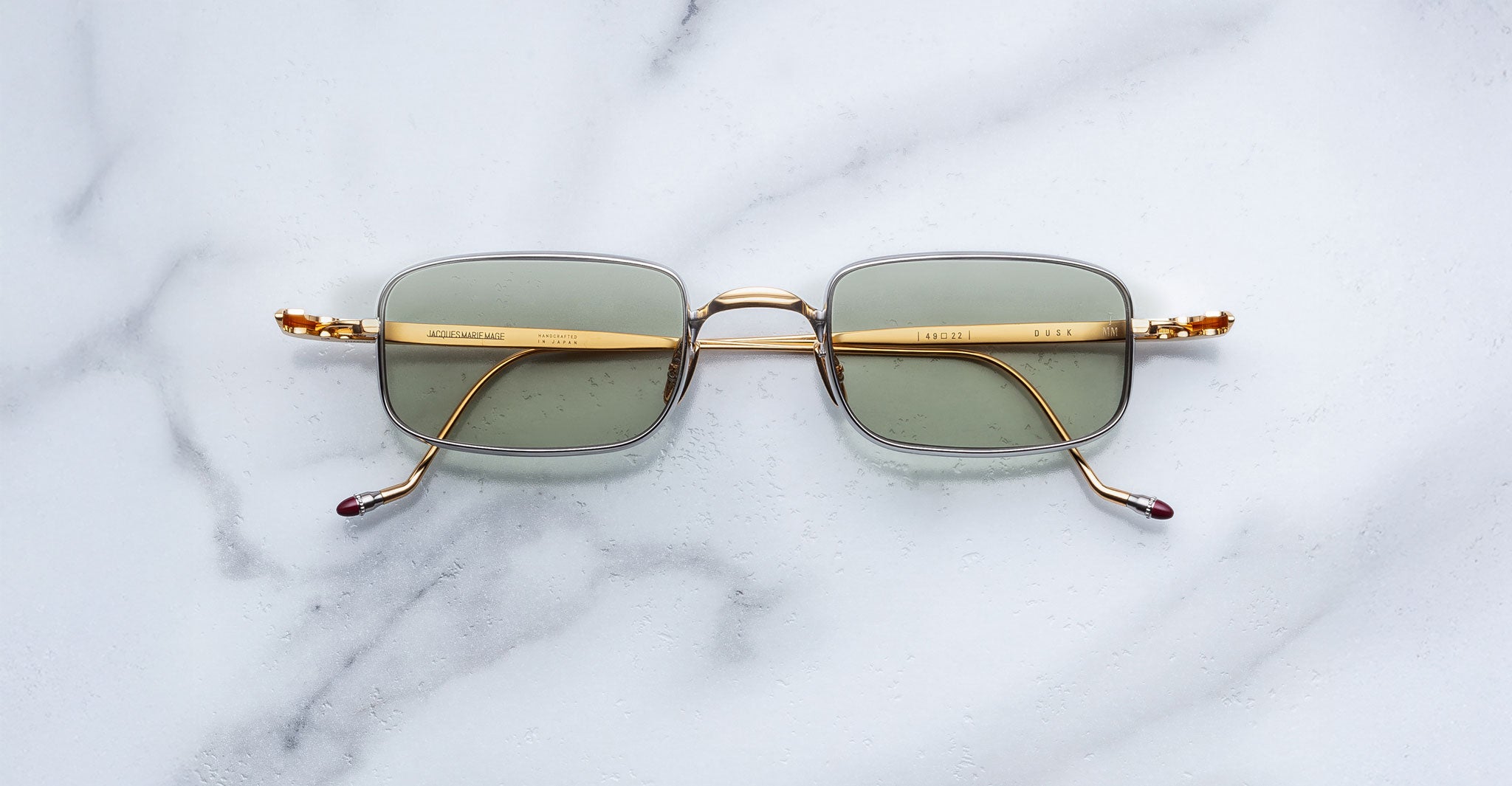 Jacques Marie Mage Dusk sunglasses with green lenses, top view.
